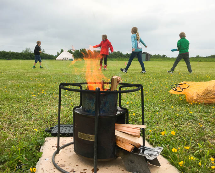 You don't need grand trips for a family adventure. A tent in a field, with friends, is enough to create adventurous kids